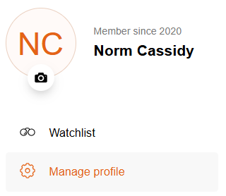 Screenshot of a user profile page showing a circular icon with the initials 'NC' in orange. Below it reads 'Member since 2020' and displays the name 'Norm Cassidy.' Options include 'Watchlist' with a glasses icon and 'Manage profile' with a gear icon.